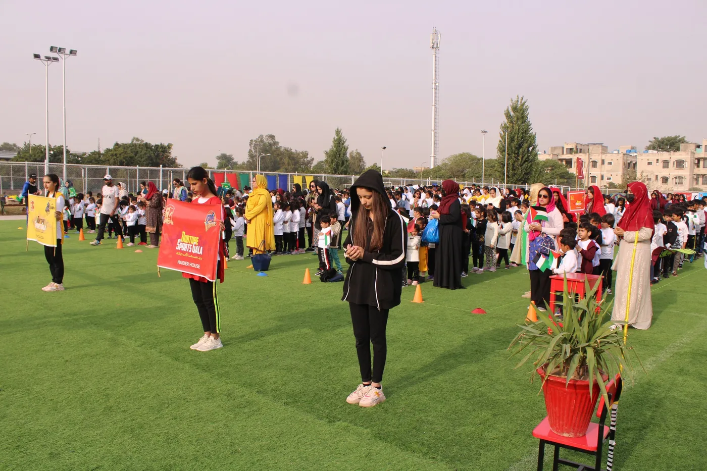 Students leading a school activity on the outdoor field